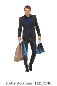 Picture Of Handsome Man In Suit With Shopping Bags.