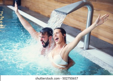 Picture Of Happy Couple Relaxing In Pool Spa