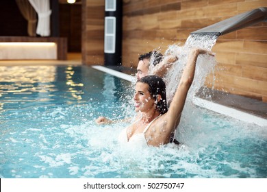 Picture Of Happy Couple Relaxing In Pool Spa