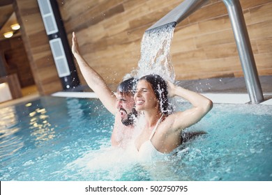 Picture Of Happy Couple Relaxing In Pool Spa