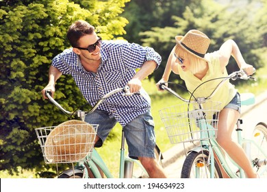 A Picture Of A Happy Couple Spending Free Time On Bikes In The City