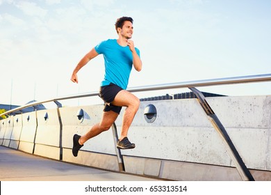 Picture Of Happy Man Running On Bridge