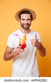 Picture Of Happy Man In Summer Hat With Cocktail Looking Camera Isolated Showing Thumbs Up.