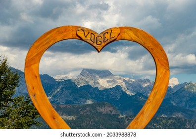 A picture of the heart at the top of the Vogel ski resort looking through the Triglav peak.