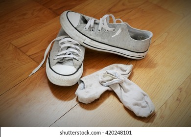 Picture Illustrating A Teenager Messy Bedroom With Sneakers And Dirty Socks, With A Vignetting Effect