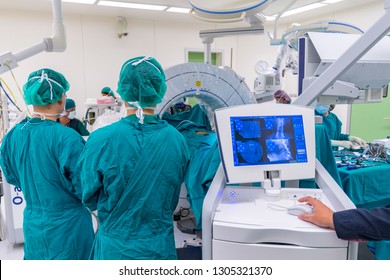 The picture of intra operative computer tomography scan while perform minimal invasive spinal surgery in modern operating room with sterile instrument tray. Advance medical technology. - Shutterstock ID 1305321370