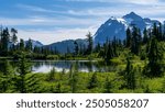 Picture Lake located in the Mt Baker of Washington State famous for its stunning reflections of Mt Sheksan, surrounded by lush alpine meadows and evergreen forests creating a picturesque settings.