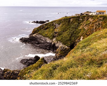 A picture of Lizard Point, Cornwall. A coastal scene showing the cliffs, sea, rocks, cafe and foliage. - Powered by Shutterstock