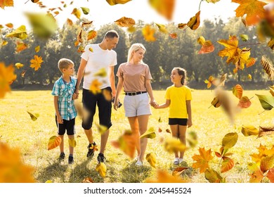 Picture Of Lovely Family In Autumn Park, Young Parents With Nice Adorable Kids Playing Outdoors, Five Cheerful Person Have Fun On Backyard In Fall, Happy Family Enjoy Autumnal Nature