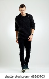 Picture Of A Male Fashion Model Wearing Wool Sweater, Walking