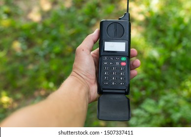 Picture Of A Man Holding Brick Cell Phone