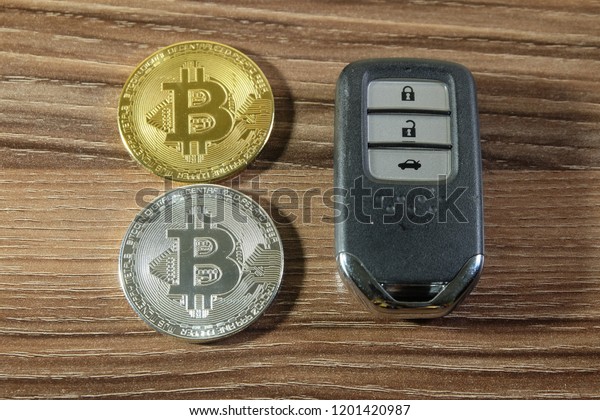 A picture of\
a man pay a car by using\
Bitcoin.