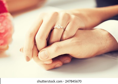 picture of man and woman with wedding ring - Shutterstock ID 247845670