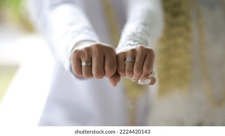 Picture of man and woman with wedding ring.Young married couple holding hands, ceremony wedding day. Newly wed couple's hands with wedding rings. - Powered by Shutterstock