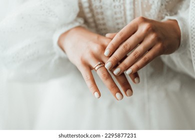 Picture of man and woman with wedding ring.Young married couple holding hands, ceremony wedding day. Newly wed couple's hands with wedding rings. - Shutterstock ID 2295877231
