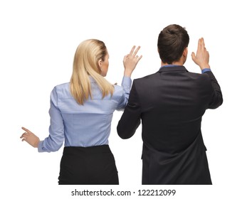 picture of man and woman working with something imaginary.