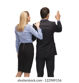 picture of man and woman working with something imaginary.