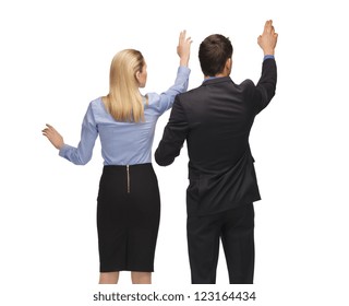 picture of man and woman working with something imaginary.