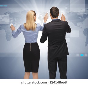 picture of man and woman working with something imaginary.