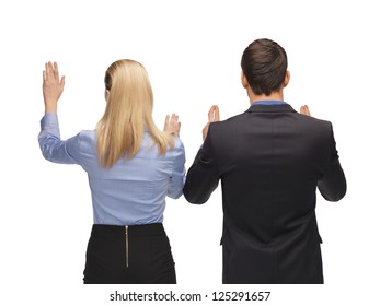picture of man and woman working with something imaginary.