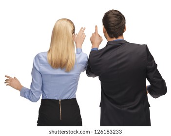 picture of man and woman working with something imaginary.