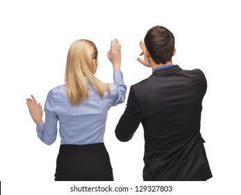 picture of man and woman working with something imaginary.