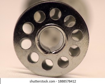 Picture of metal bobbins, used for winding thread that using on sewing machine