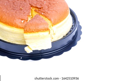 A Picture Of Moist Cheesecake Slice, Left And Lift On The Plate.