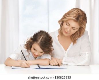 picture of mother and daughter doing home work