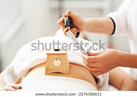 Picture of moxibustion therapy on woman body