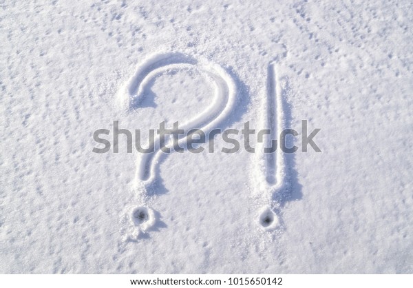 Picture on the snowy window. Symbols - question and\
exclamation mark