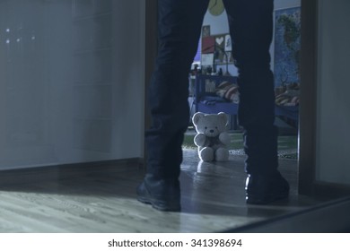 Picture of pedophile standing at the child room entry