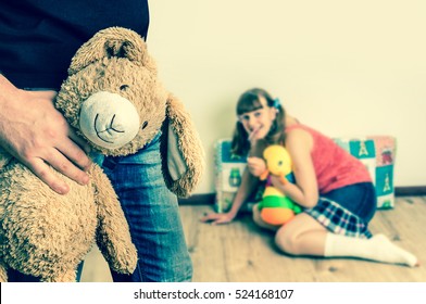 Picture of pedophile standing in the child room and offering cuddly toy to young girl - retro style