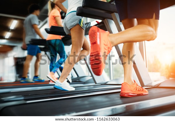 Picture of people\
running on treadmill in\
gym