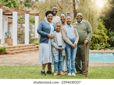 Picture perfect family. Full length portrait of a multi-generational family standing outside in the garden. - Powered by Shutterstock