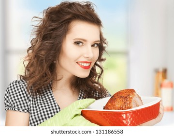 picture of perfect housewife serving dish with meat
