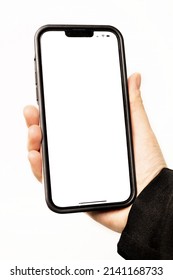 Picture of a person holding a smartphone. Isolated image, can be used as a mockup. Whitespace and empty room for own image. One person, indoors. 