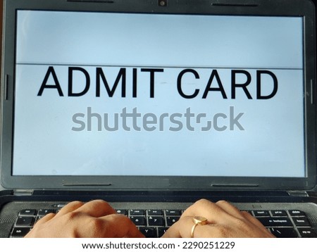 Picture of a person searching for admit card on an entrance exam on a laptop. Admit Card is written on screen.