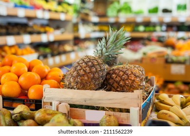 Picture Of Pineapples On Counter In Food Market, No People