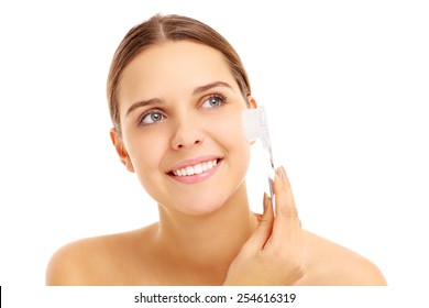 A Picture Of A Pretty Woman With A Face Brush Over White Background