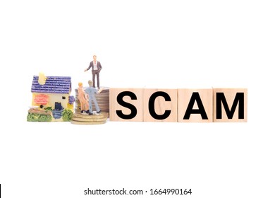 A picture of property scam concept using wooden block and miniature. Many people been deceived in property game that lead to scam and high housing loan.