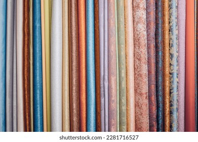 Picture of random shades of fabric canvases arranged in row. Cold and warm colors. Materials for creating new interesting and fashionable product.