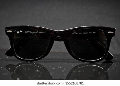 Picture of a Ray-Ban wayfarer under some dust;