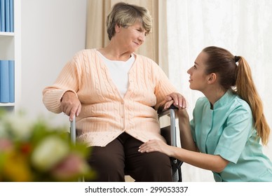 Picture of retired woman having professional care in rest home