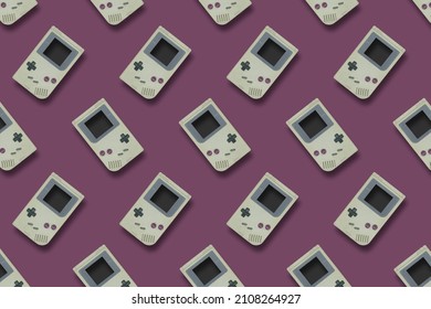 Picture Of Retro Handheld Gray Game Console Pattern On Violet Background