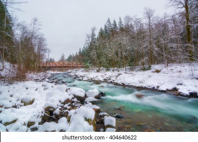A picture of a river in the winter condition.  The location is Mt.Hood National Forest, near Portland, Oregon, USA
