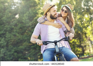 Picture Of Romantic Couple Riding Bikes