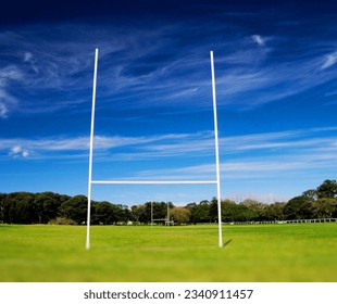 A picture of rugby players with a rugby ball, men playing, a stadium with rugby field, cheering fans, and lush green turf. - Powered by Shutterstock