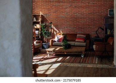 A Picture Of A Rustic And Cozy Living Room With Sunlight Coming Through The Window.