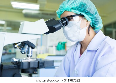 Picture of scientist using a microscope in a laboratory, Concept science and Technology,  Science background